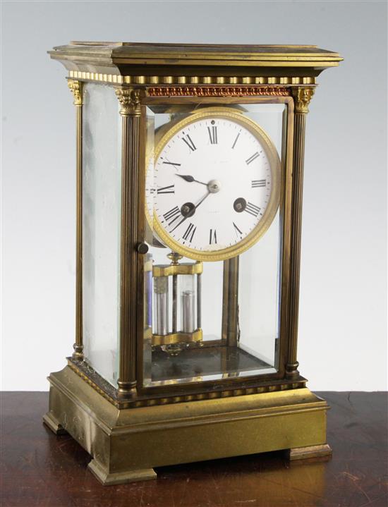 An Edwardian brass four glass mantel clock, 11in.